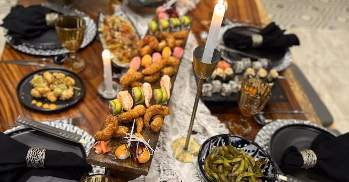 A private chef’s dinner spread on a candlelit villa table