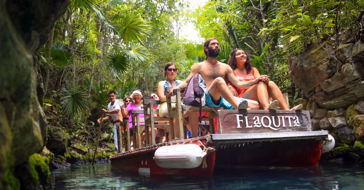 Visitors on a boat ride along the jungle river at Xcaret