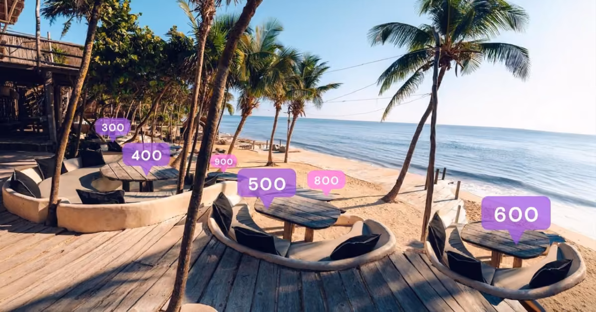Beachside seating area with round tables under palm trees, facing the ocean. Purple labels 300 to 900 float above the tables.