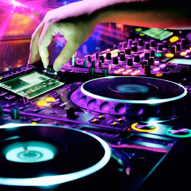 A DJ’s hand works a brightly lit mixer and turntable, surrounded by colorful lights, creating a lively party atmosphere.