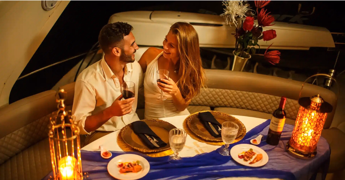 couple enjoying dinner on a boat near tulum
