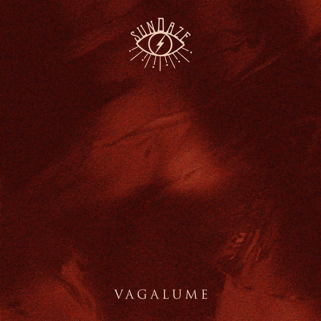 A deep red textured background features a stylized eye with lines and the word SUNDAZE at the top. At the bottom, VAGALUME TULUM appears in bold white capital letters.