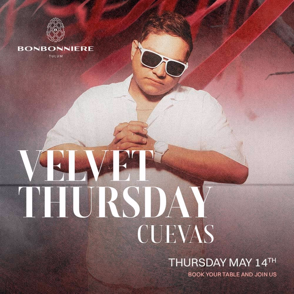 Man in white shirt and sunglasses poses before a colorful smoky backdrop. Velvet Thursday at Bonbonniere Tulum, May 14.