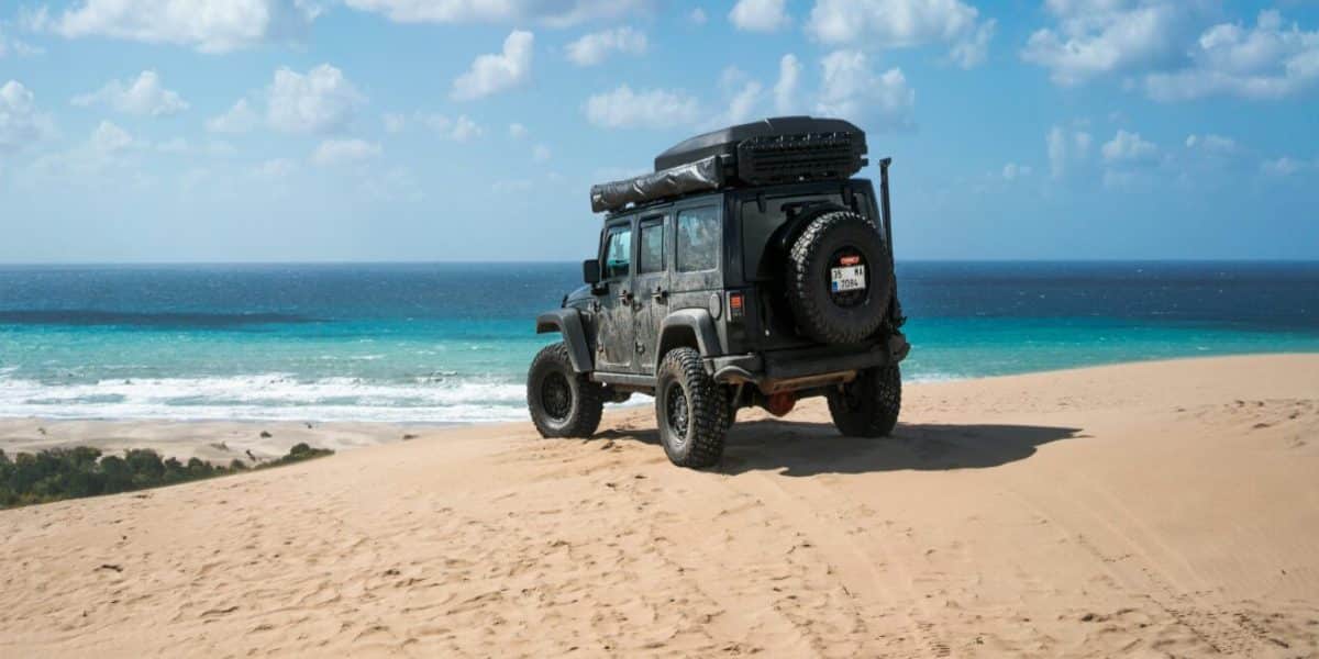 A rental jeep on the beach of Tulum