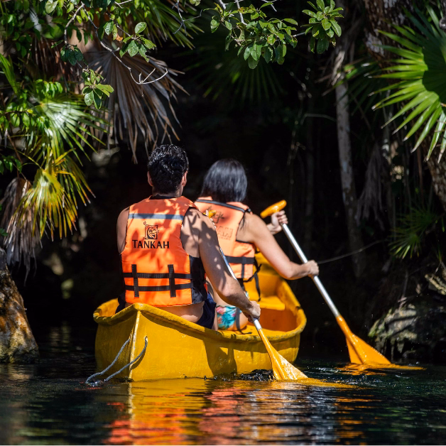 people in a kayak near tulum