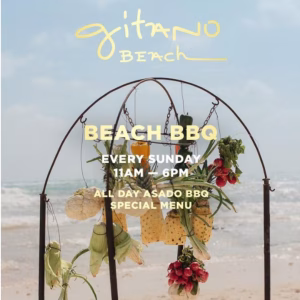 An arch with pineapples, lettuce, and peppers stands on a beach. Sign: Gitano Beach BBQ, Sundays 11am–6pm. Asado menu.