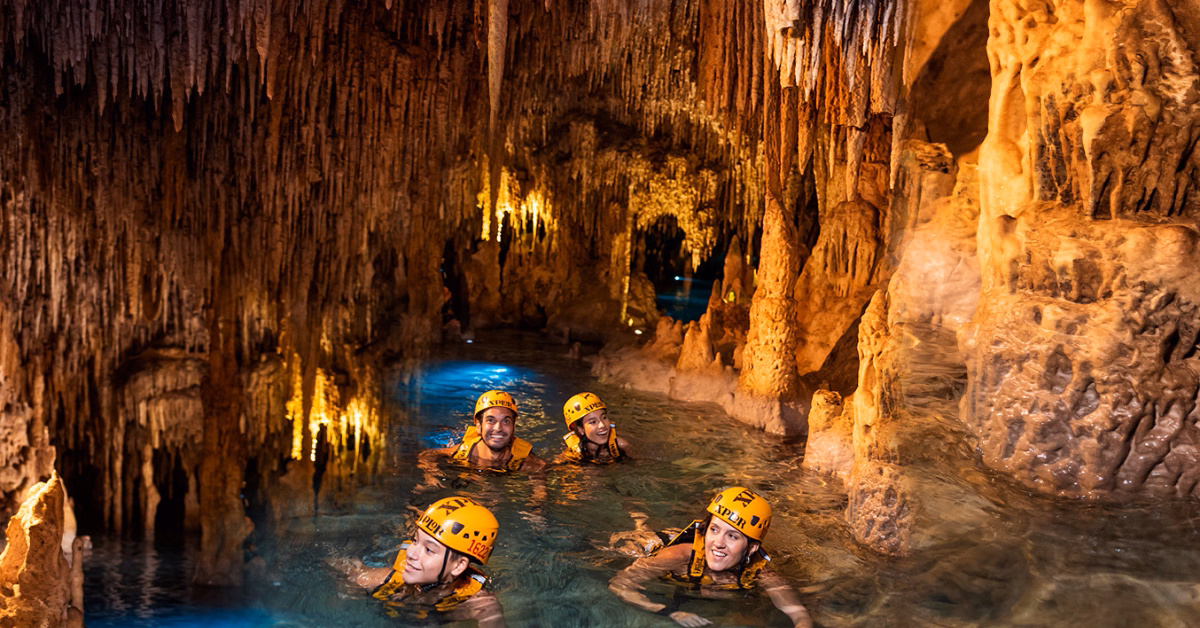 group in a cenote at xplor